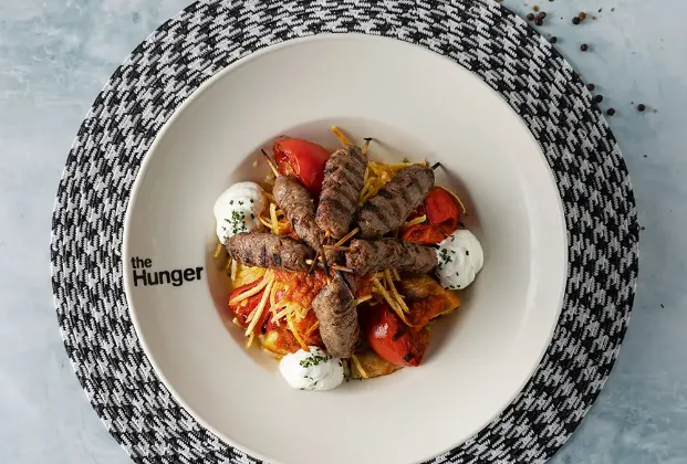 Yogurt with skewered meatballs