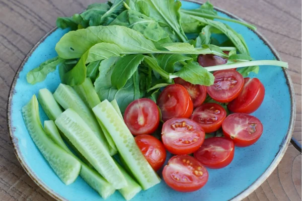Tomatoes and cucumber with olive oil