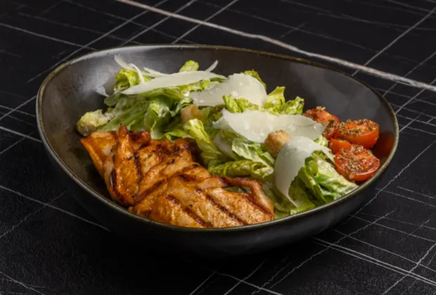 Caesar salad with grilled chicken breast