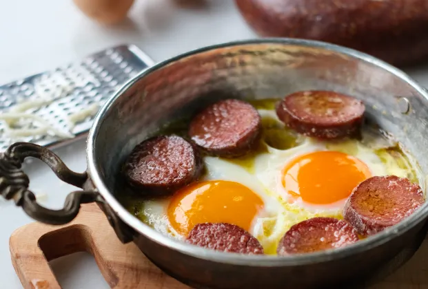 Pan-fried eggs with Turkish sausage