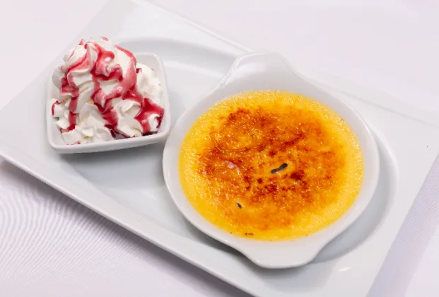 Crème brûlée with sour cherry compote and cream