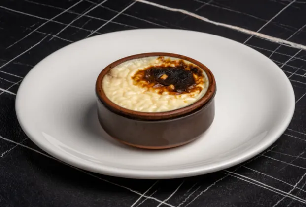 Baked rice pudding with pişmaniye, vanilla ice cream and crushed hazelnuts