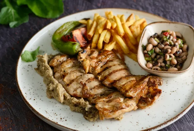 Grilled chicken drumstick with mountain thyme