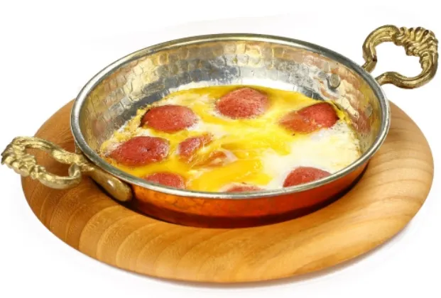 Pan-fried eggs with sucuk and kaşar cheese