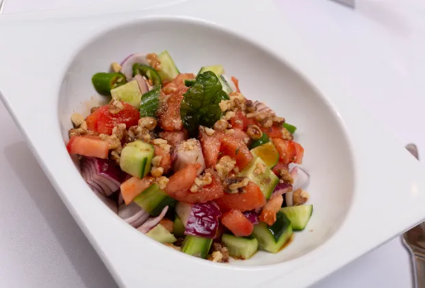 Shepherd salad with pomegranate molasses and walnuts
