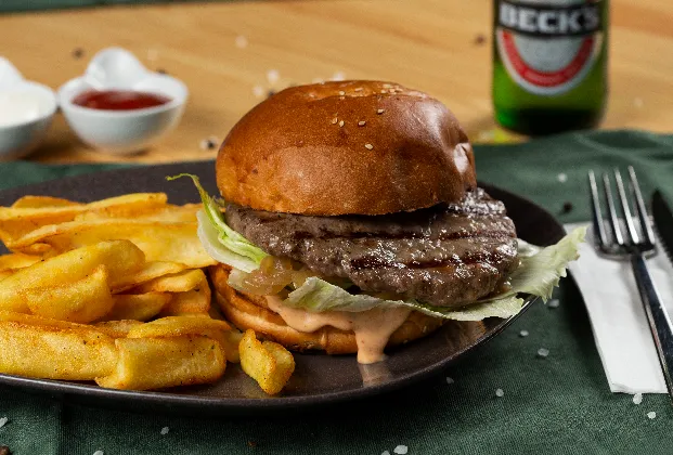 American Burger with caramelized onion, special burger sauce and spicy fries