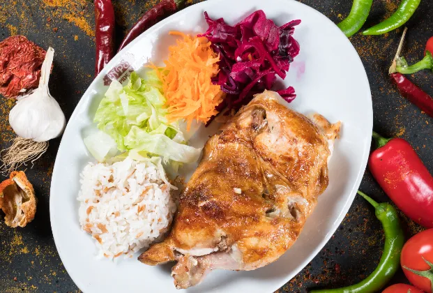 Half rotisserie chicken with rice and salad