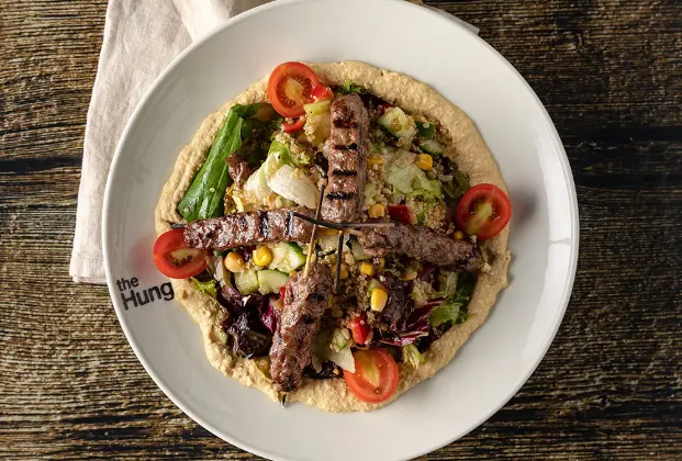 Hummus and quinoa skewered meatball salad