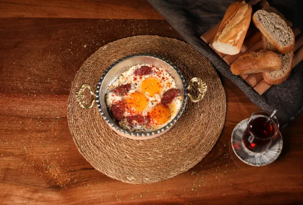 Sucuk and eggs in a pan