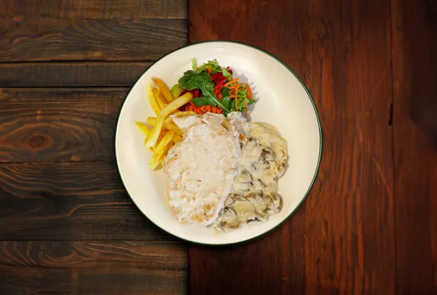Chicken with mushroom sauce and cheese