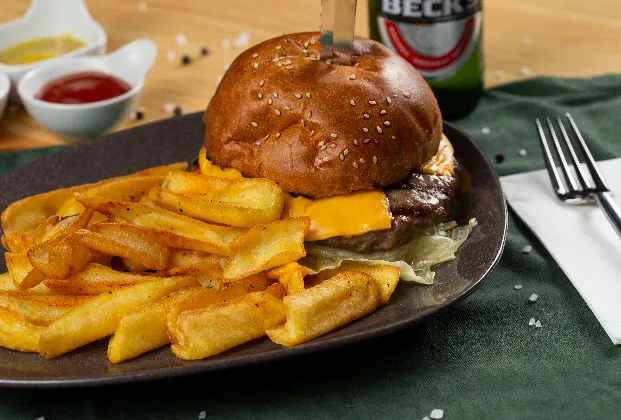American Burger with Cheese, Cheddar, Caramelized Onion, Spicy Burger Sauce, and Seasoned Fries