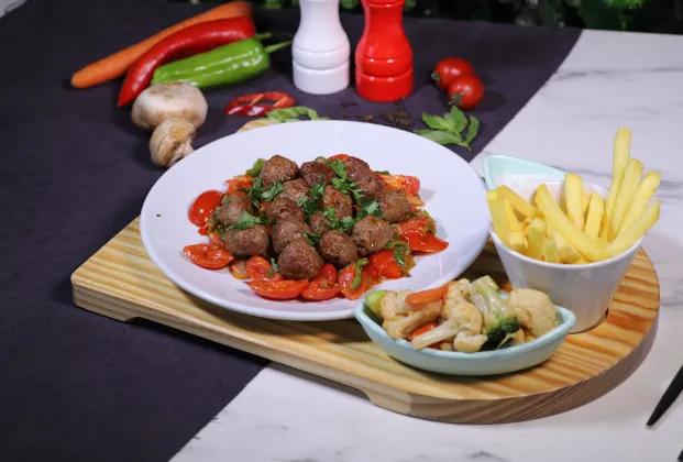Misket Köfte on a bed of vegetables
