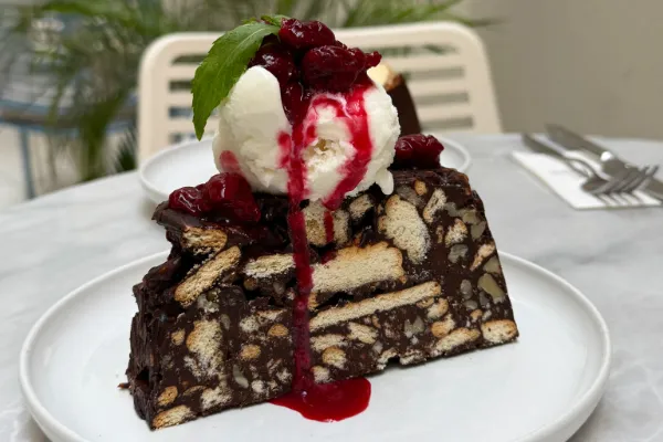 Mosaic cake with ice cream and sour cherry sauce